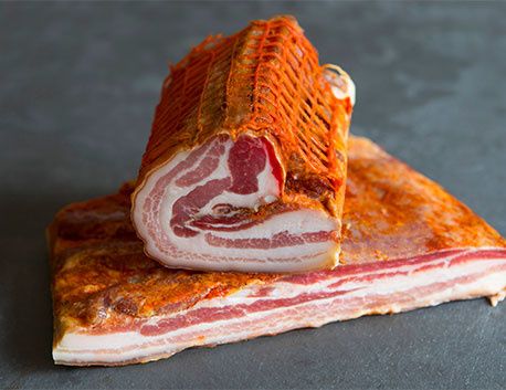Rolled pork belly rubbed with red pepper